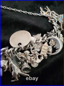 Silver Charm Bracelet 109.60 Grams Over 32 Charms