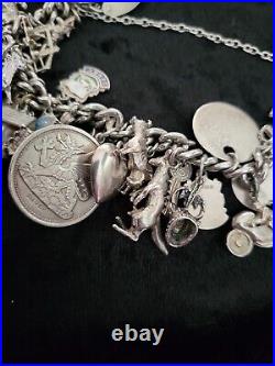 Silver Charm Bracelet 109.60 Grams Over 32 Charms