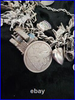 Silver Charm Bracelet 109.60 Grams Over 32 Charms