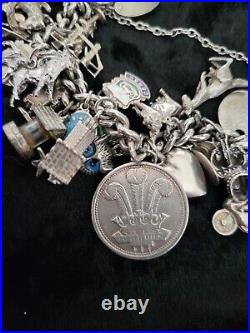 Silver Charm Bracelet 109.60 Grams Over 32 Charms