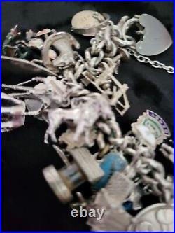 Silver Charm Bracelet 109.60 Grams Over 32 Charms