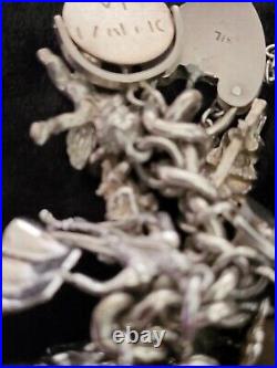 Silver Charm Bracelet 109.60 Grams Over 32 Charms