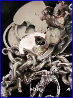 Silver Charm Bracelet 109.60 Grams Over 32 Charms