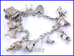 Silver Charm Bracelet Including 11 Charms Church Dancer Puppet 35.06 Grams