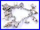 Silver-Charm-Bracelet-Including-11-Charms-Church-Dancer-Puppet-35-06-Grams-01-ymbe