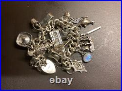 Silver Charm Bracelet with 18 Charms + Lock + Chain. 171.48g