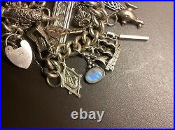 Silver Charm Bracelet with 18 Charms + Lock + Chain. 171.48g