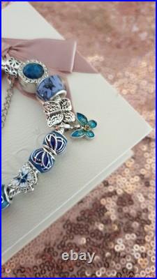 Silver Pandora Bracelet Butterfly Clasp + Charms Shown + Pandora Box. 19 cms Silver Pandora Bracelet Butterfly Clasp + Charms Shown + Pandora Box. 19 cms