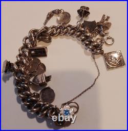 Silver charm bracelet 95.47g Silver Many Interesting Charms Making It Unique