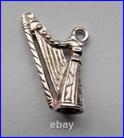 Silver charm of a harp perfect for a traditional charm bracelet