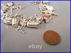 Silver hallmarked flat curb link charm bracelet with 20 charms