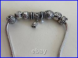 Silver pandora bracelet with 9 silver charms, good condition