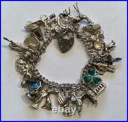 Solid Silver Charm Bracelet with 27 Wonderful Charms. Beautiful Vintage Piece