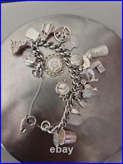 Solid Silver Heavy Charm Bracelet Lots of Interesting Charms. 83 Grams