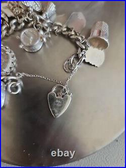 Solid Silver Heavy Charm Bracelet Lots of Interesting Charms. 83 Grams