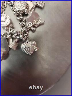 Solid Silver Heavy Charm Bracelet Lots of Interesting Charms. 83 Grams