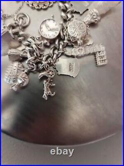 Solid Silver Heavy Charm Bracelet Lots of Interesting Charms. 83 Grams