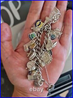 Solid Silver Heavy Charm Bracelet Lots of Interesting Charms. 83 Grams