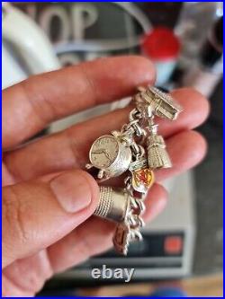 Solid Silver Heavy Charm Bracelet Lots of Interesting Charms. 83 Grams