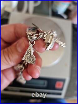 Solid Silver Heavy Charm Bracelet Lots of Interesting Charms. 83 Grams