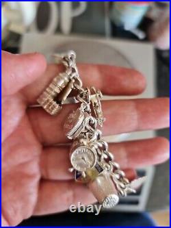 Solid Silver Heavy Charm Bracelet Lots of Interesting Charms. 83 Grams