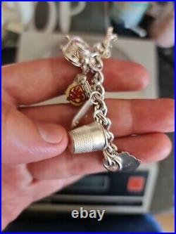 Solid Silver Heavy Charm Bracelet Lots of Interesting Charms. 83 Grams