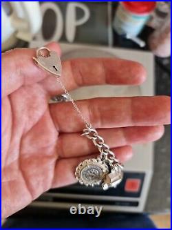 Solid Silver Heavy Charm Bracelet Lots of Interesting Charms. 83 Grams