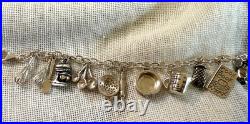 Sterling Silver. 925 charm bracelet with 21 kitchen themn charms 8.5