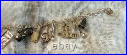 Sterling Silver. 925 charm bracelet with 21 kitchen themn charms 8.5