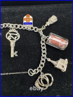 Sterling Silver Charm Bracelet with 10 Charms