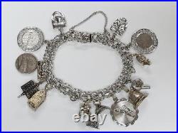 Sterling Silver Charm Bracelet with 14 Charms 7-1/2 55grams 15-E1547 Sterling Silver Charm Bracelet with 14 Charms 7-1/2 55grams 15-E1547