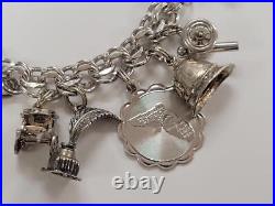 Sterling Silver Charm Bracelet with 14 Charms 7-1/2 55grams 15-E1547 Sterling Silver Charm Bracelet with 14 Charms 7-1/2 55grams 15-E1547