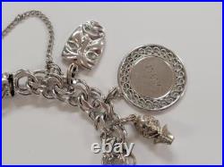 Sterling Silver Charm Bracelet with 14 Charms 7-1/2 55grams 15-E1547 Sterling Silver Charm Bracelet with 14 Charms 7-1/2 55grams 15-E1547