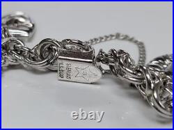 Sterling Silver Charm Bracelet with 14 Charms 7-1/2 55grams 15-E1547 Sterling Silver Charm Bracelet with 14 Charms 7-1/2 55grams 15-E1547