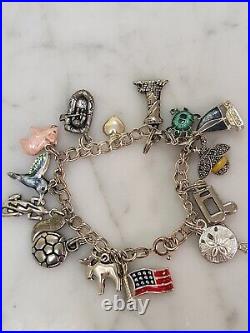 Sterling silver Charm Bracelet with 16 Charms 9 are Sterling