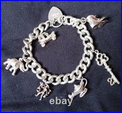 Stunning vintage solid silver 925 charm bracelet With 6 charms 59.3g