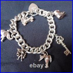 Stunning vintage solid silver 925 charm bracelet With 6 charms 59.3g