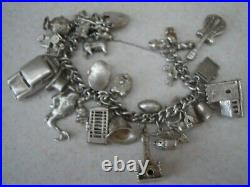 Stunning vintage solid silver charm bracelet 23 charms. 135gms