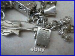 Stunning vintage solid silver charm bracelet 23 charms. 135gms