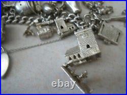 Stunning vintage solid silver charm bracelet 23 charms. 135gms