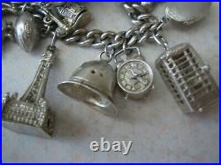 Stunning vintage solid silver charm bracelet 23 charms. 135gms