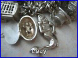 Stunning vintage solid silver charm bracelet 23 charms. 135gms