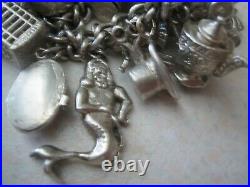 Stunning vintage solid silver charm bracelet 23 charms. 135gms