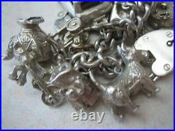 Stunning vintage solid silver charm bracelet 23 charms. 135gms