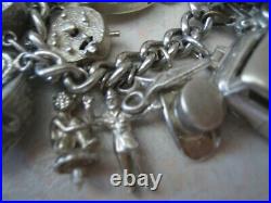 Stunning vintage solid silver charm bracelet 23 charms. 135gms