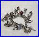Stunning-vintage-solid-silver-charm-bracelet-charms-Rare-open-move-01-wfcc