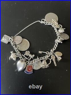 Superb vintage Antique solid silver charm bracelet and charms