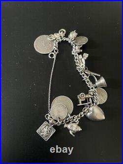 Superb vintage Antique solid silver charm bracelet and charms