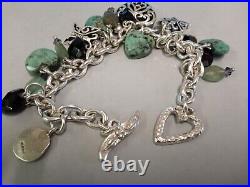 Tested as silver bracelet with silver and stone set charms. Weighs 66gms in total