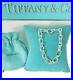 Tiffany-Co-Silver-Oval-Clasp-end-only-Clasping-Link-7-Charm-Bracelet-01-euxt